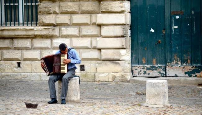 Person playing an accordion in France